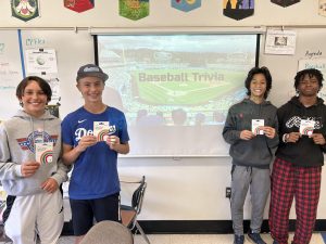 The winners of the Baseball Trivia contest proudly display their prizes.